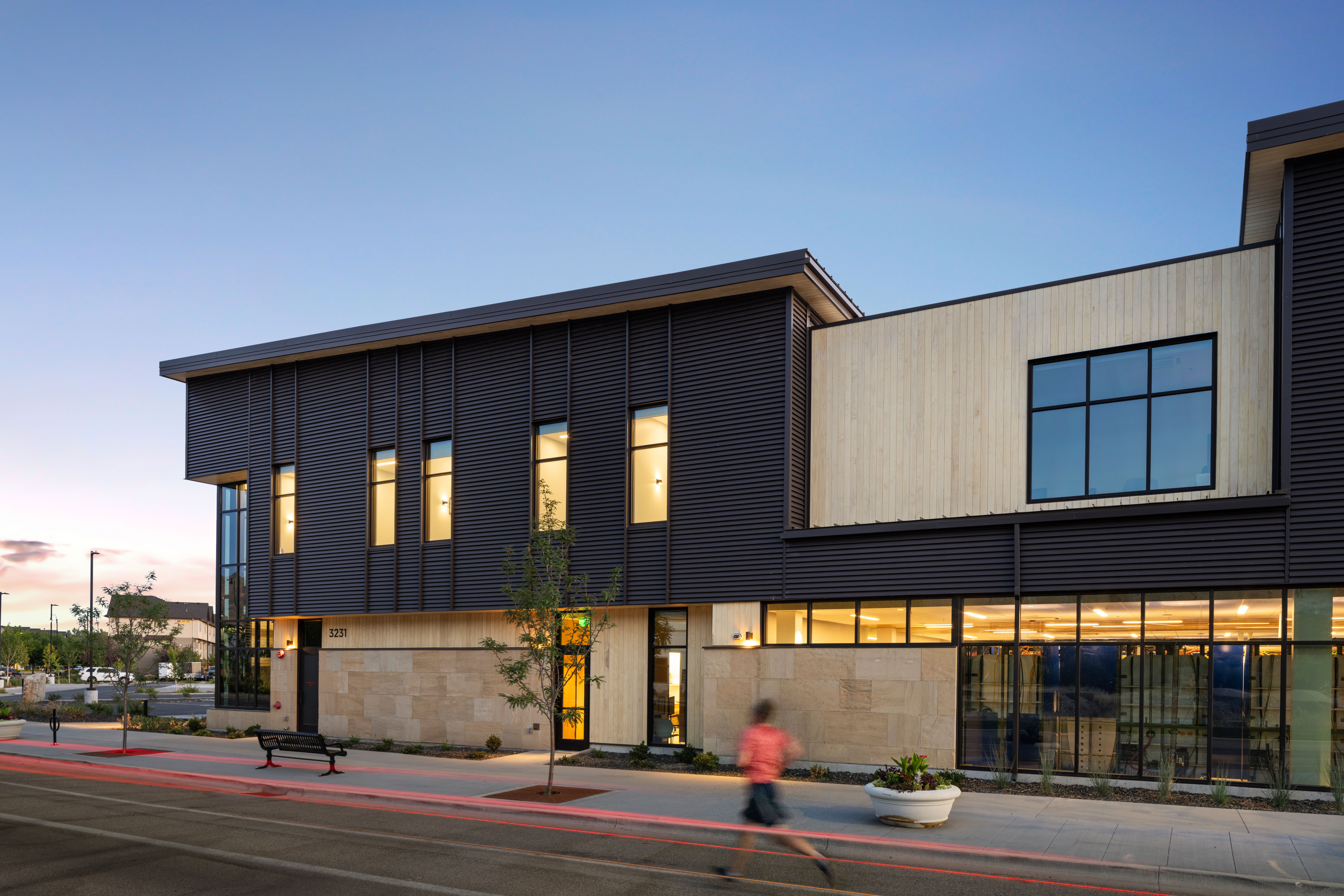 Exterior view of the Summit Hyperbarics & Wellness building with its modern facade and surrounding grounds.
